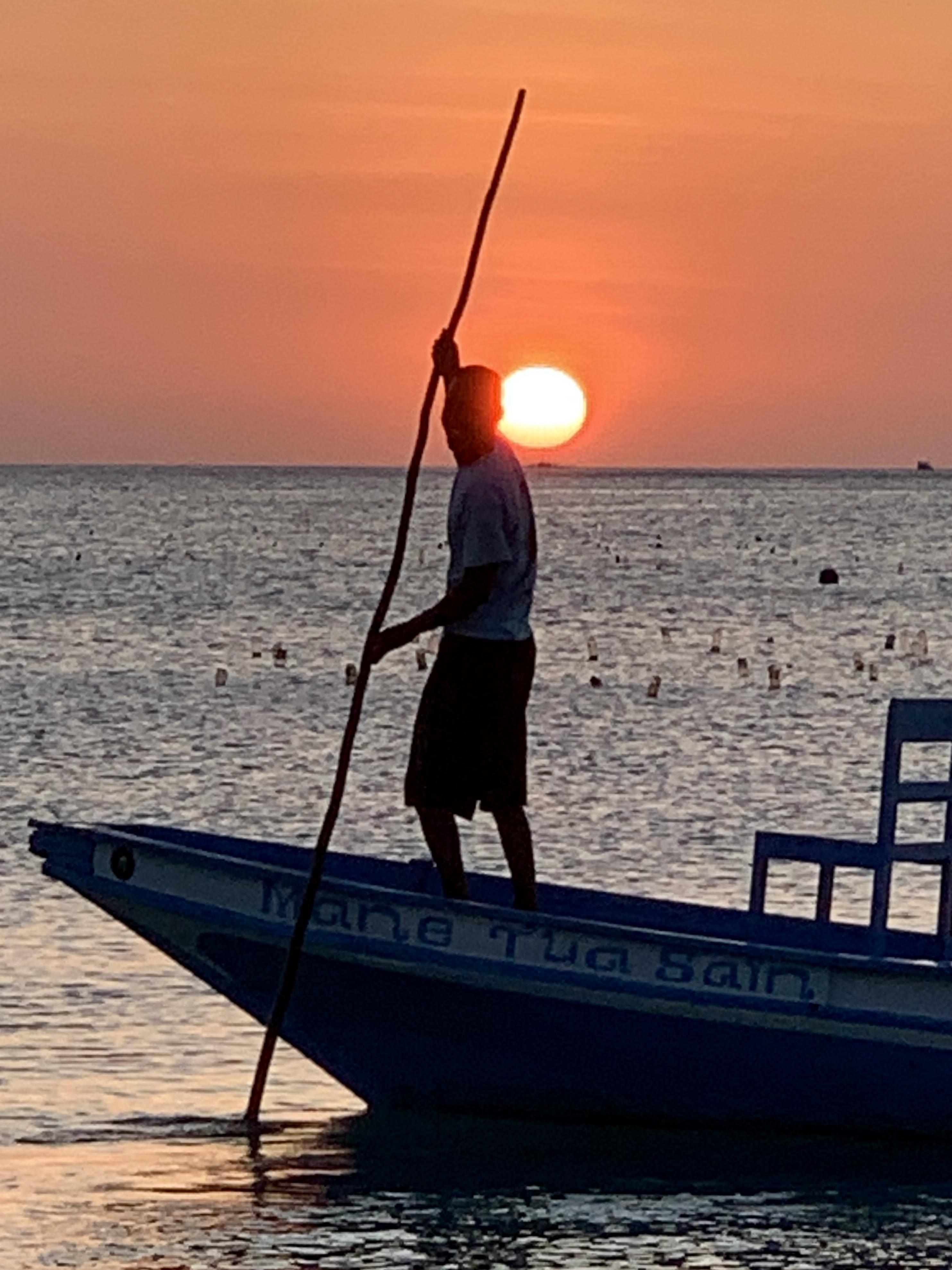 Boat at
            sunset